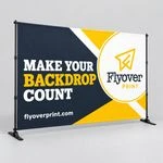 10 ft Flyover Print slider backdrop in navy and gold reading Make Your Backdrop Count on a gray studio floor